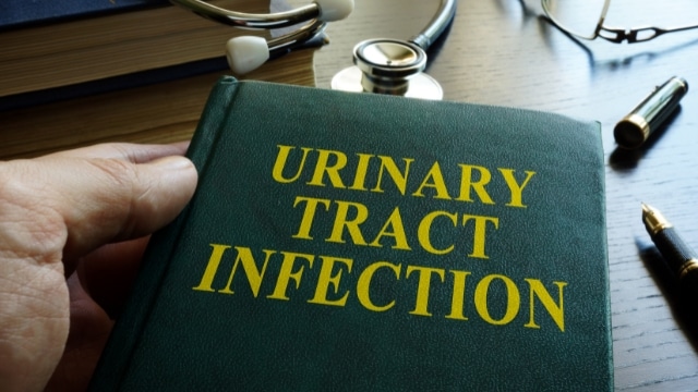 adhering to the walls of your urinary tract