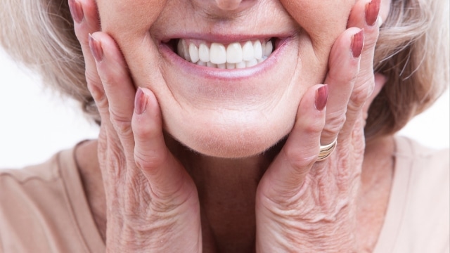 smile with COREGA MAX denture adhesive